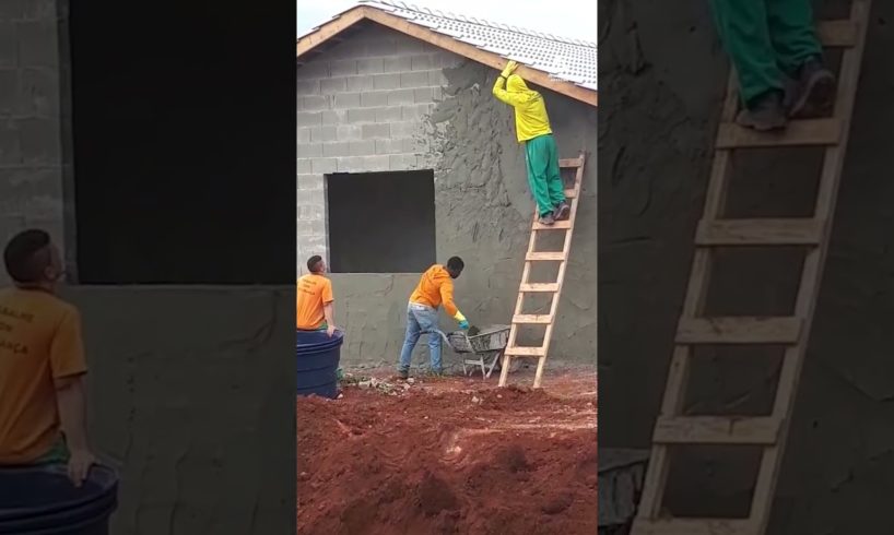 Masonry Worker Throws Cement to Cover Wall | People Are Awesome