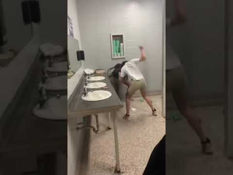 2 girls fighting in the bathroom