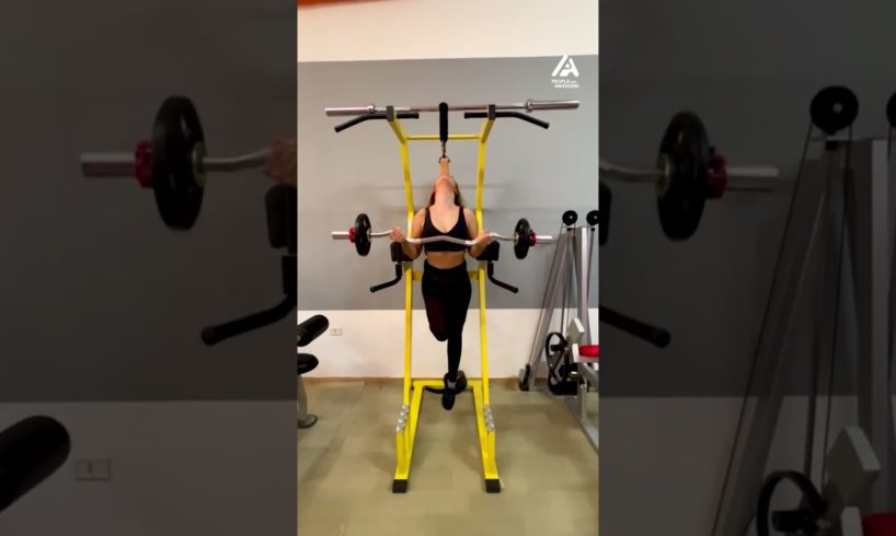 Woman Does Barbell Curls While Hanging By Teeth | People Are Awesome #shorts