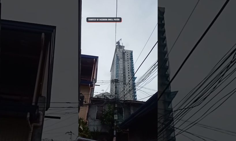 Earthquake makes debris, part of a crane fall from a building in Matina, Davao City