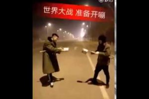 Extremely dangerous street fight: Two guys launch firework fight during Spring Festival