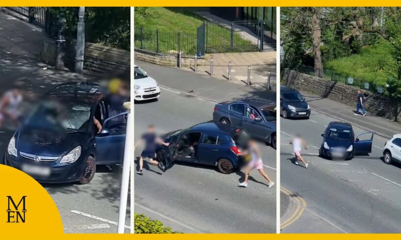 Moment fight breaks out between motorists on main road