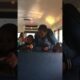 They are fighting on the school bus