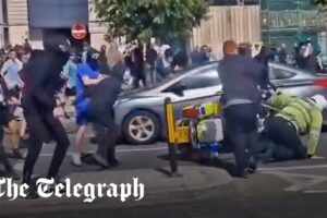 Liverpool clashes: Police officer pushed off motorbike and attacked by far-Right rioters