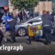 Liverpool clashes: Police officer pushed off motorbike and attacked by far-Right rioters