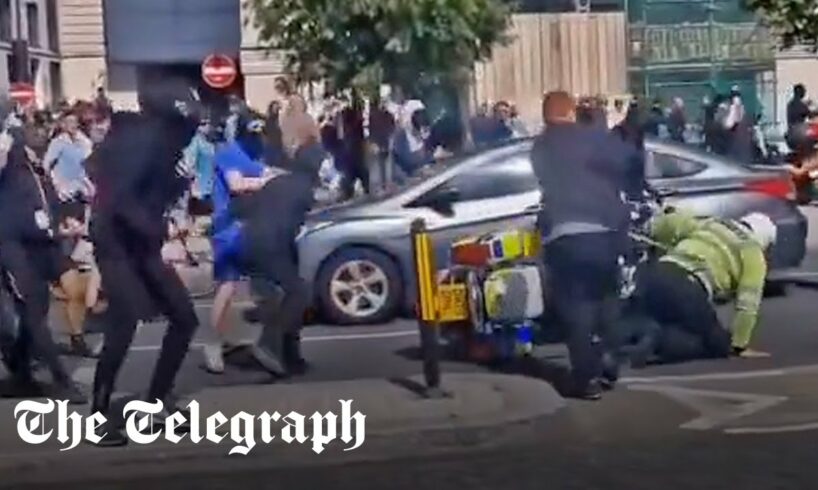 Liverpool clashes: Police officer pushed off motorbike and attacked by far-Right rioters