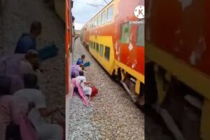 Indian woman pulls death defying stunt infront of speeding train | Watch Video| Oneindia News