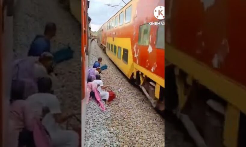 Indian woman pulls death defying stunt infront of speeding train | Watch Video| Oneindia News