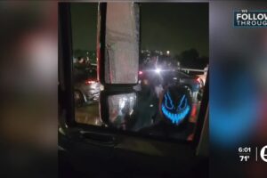 Masked mob confronts party bus on freeway