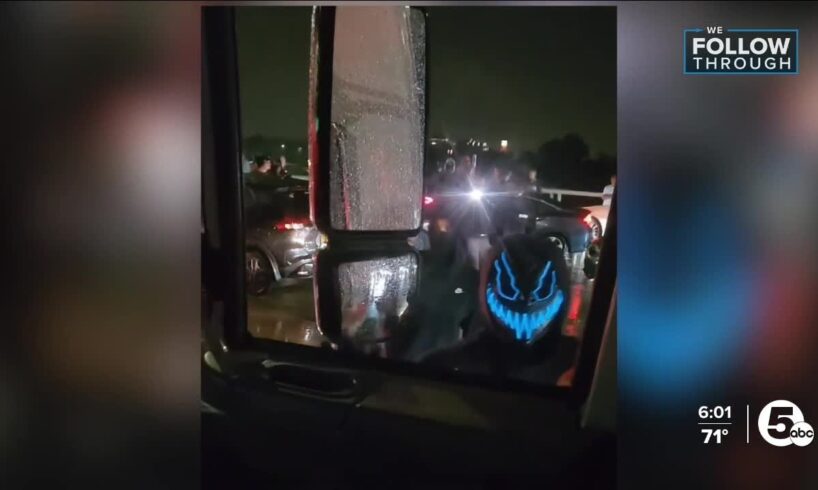 Masked mob confronts party bus on freeway