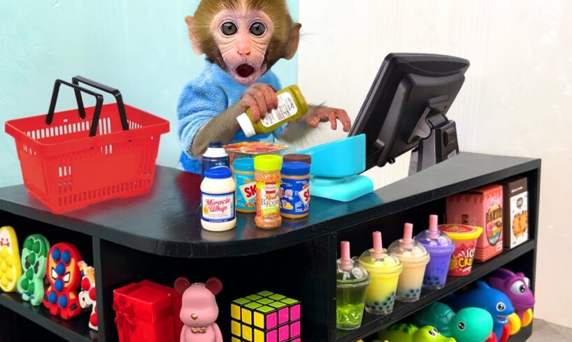 Monkey Baby Bon Bon pretend to be a cashier in a supermarket and eats watermelon with puppy