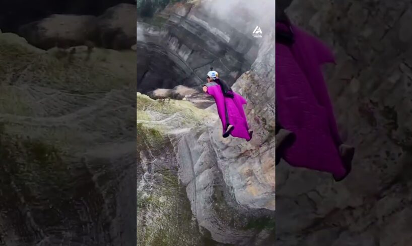 Wingsuit Jump Through Mountain Pass | People Are Awesome